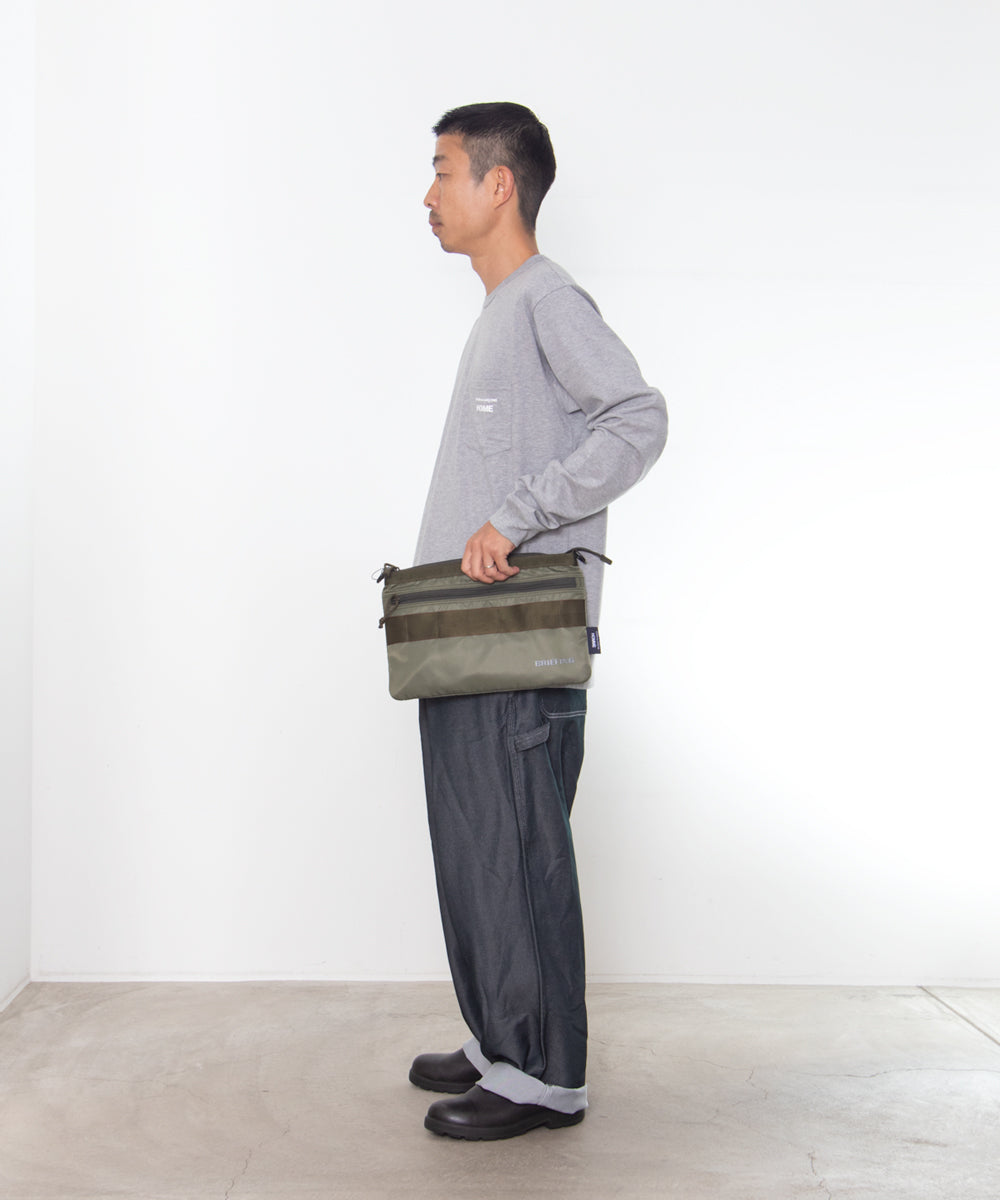 COMME des GARCONS HOMME / HR-K209 / BRIEFING W Name Reversible Sacoche Bag / 26FW / Khaki